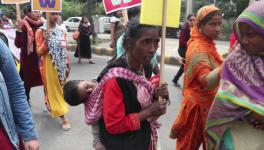 women carrying child international womens day