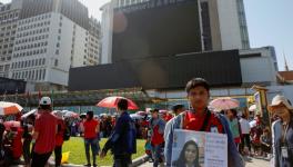 Workers protesting outside NagaWorld, on the day of the strike. Photo: Reuters