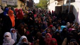 Women resisting police from entering the protest site in Shah Jamal, Aligarh