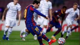 Lionel Messi of FC Barcelona scores against Dynamo Kiev