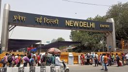 Stranded people rushing to New Delhi railway station to catch their train during fourth phase of the lockdown