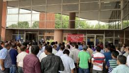 LIC employees protest at Jeevan Bharati building, Connaught Place, New Delhi, on Wednesday. Image: Ronak Chhabra.