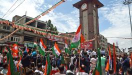 Bharatiya Janata Party (BJP) supporters hold party flags and National flags during the first-ever Tiranga Bike rally flagged off by BJP National General Secretary Tarun Chugh from Ghanta Ghar, Lal Chowk