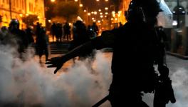 Police trying to break up supporters of ousted President Pedro Castillo at plaza San Martin in Lima, Peru, Sunday