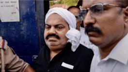 UP Police with jailed-mafia Atiq Ahmed outside Sabarmati Central Jail as he is being shifted to Prayagraj, in Ahmedabad.