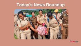 Police personnel arrest a local woman protesting against an eviction drive by Guwahati Metropolitan Development Authority (GMDA) at Silsako Beel, in Guwahati.