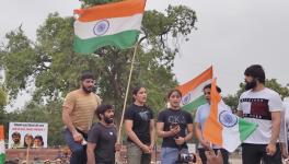 Wrestlers address the crowd at the candlelight march in Delhi in May 2023. (Photo: Surangya)