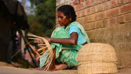 Ranu Bauri an old-age woman from Bhutsahar village under Bankura 2 Block is making bamboo baskets with a loan from Microfinance Company. Gramin bank reluctant to give loan.