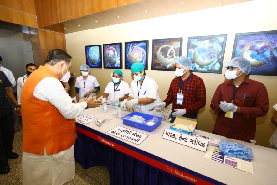 CM Vijay Rupani after his arrival at Vidhan Sabha, Gandhinagar and checking preventive arrangement for voting amid COVID-19