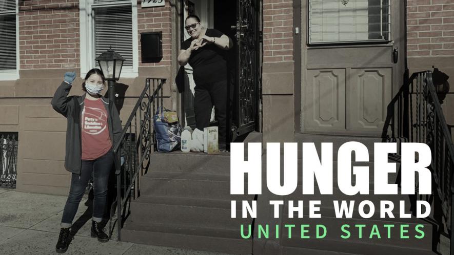 Kayla, PSL Member and Liberation Center Volunteer, poses with a neighbor after distributing groceries. Photo: Philadelphia Liberation Center