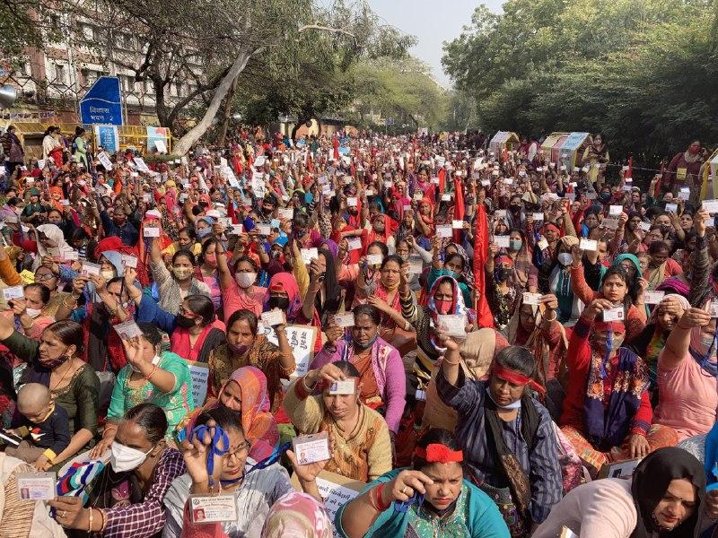 Striking anganwadi workers and helpers showcase their ID cards on Tuesday. Image clicked by Ronak Chhabra