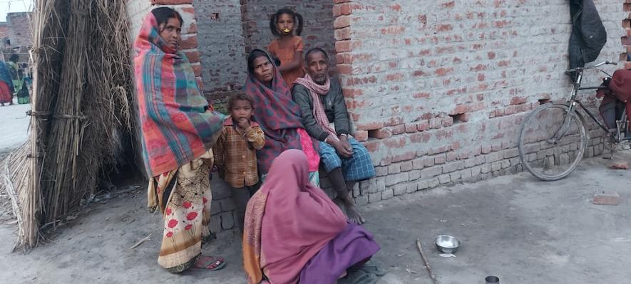 Leela with her family and fellow villagers