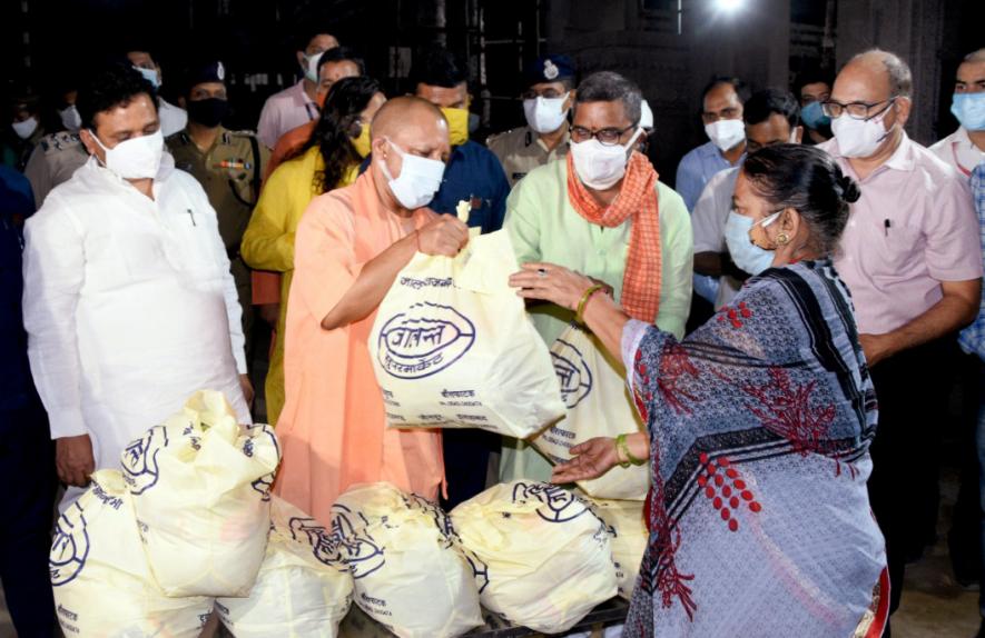 Uttar Pradesh CM Yogi Adityanath distributes ration to people