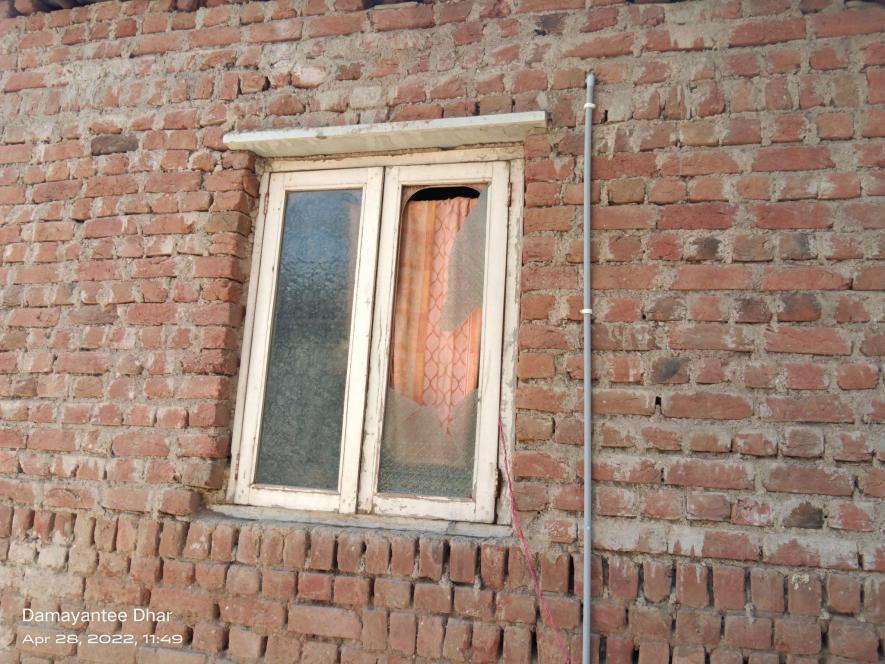 Damaged window at Zeba’s home