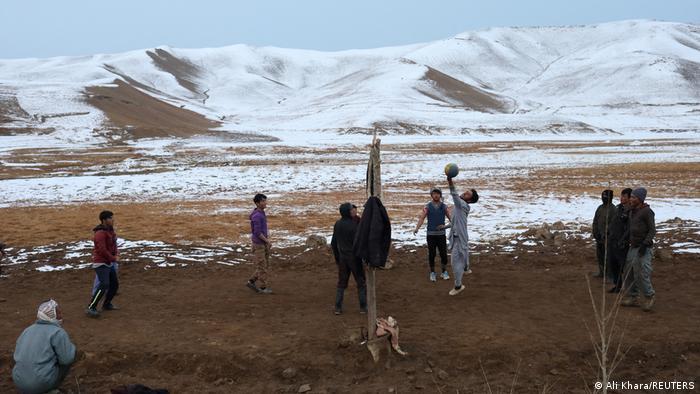 Boys playing volleyball in Afghanistan – an activity which was frowned upon for girls