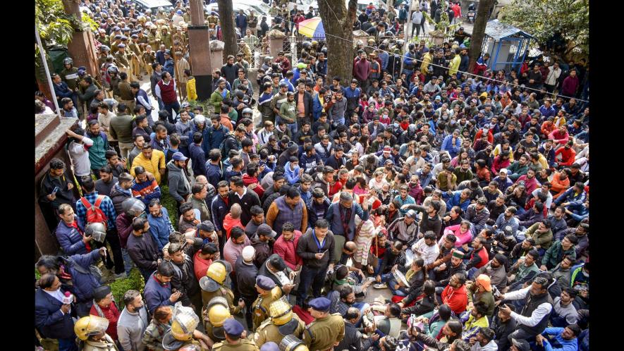 Dehradun: Youths stage a protest at Shaheed Smarak in district court premises against police action during Thursday's protest over alleged irregularities in state government recruitment examinations, in Dehradun, Friday, Feb. 10, 2023. (PTI Photo)