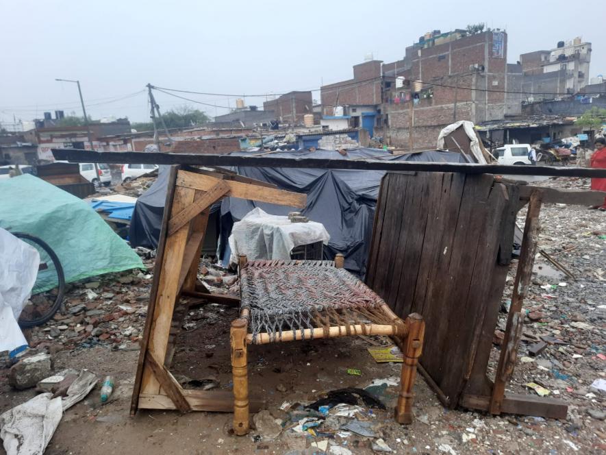 The temporary shelter the father and daughter built from the broken pieces and leftover belongings of their house