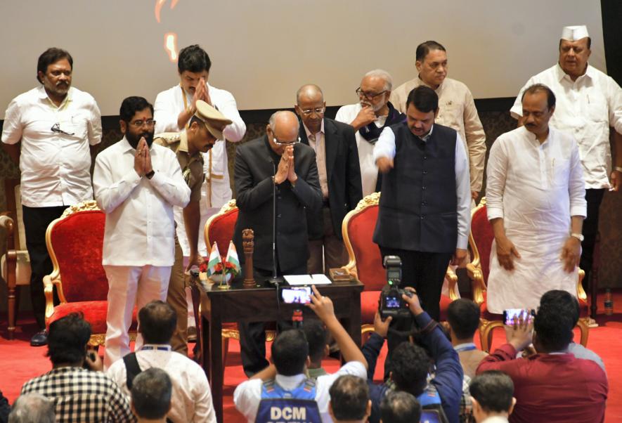 Maharashtra Governor Ramesh Bais with Chief Minister Eknath Shinde, Deputy Chief Ministers Devendra Fadnavis and Ajit Pawar, and newly sworn-in State Cabinet ministers during a ceremony at Raj Bhavan, in Mumbai, Sunday, July 2, 2023. 