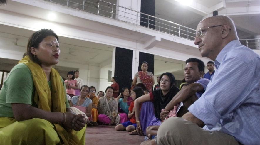 Harsh Mander, at Akhampat Relief Camp, Imphal East District, listening to a survivor from Meitei Community who escaped her home that was set on fire in the violence.