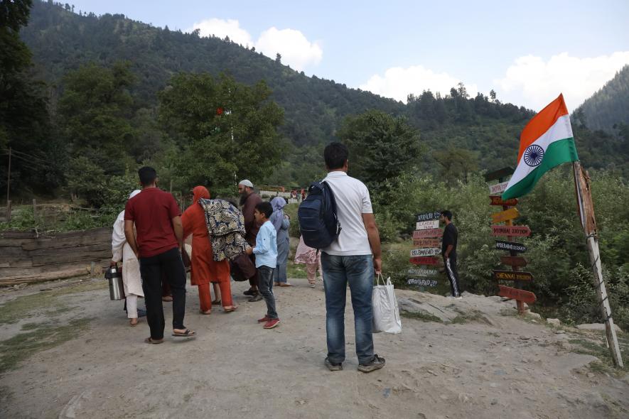 1. People clicking pictures near Kishanganga River.