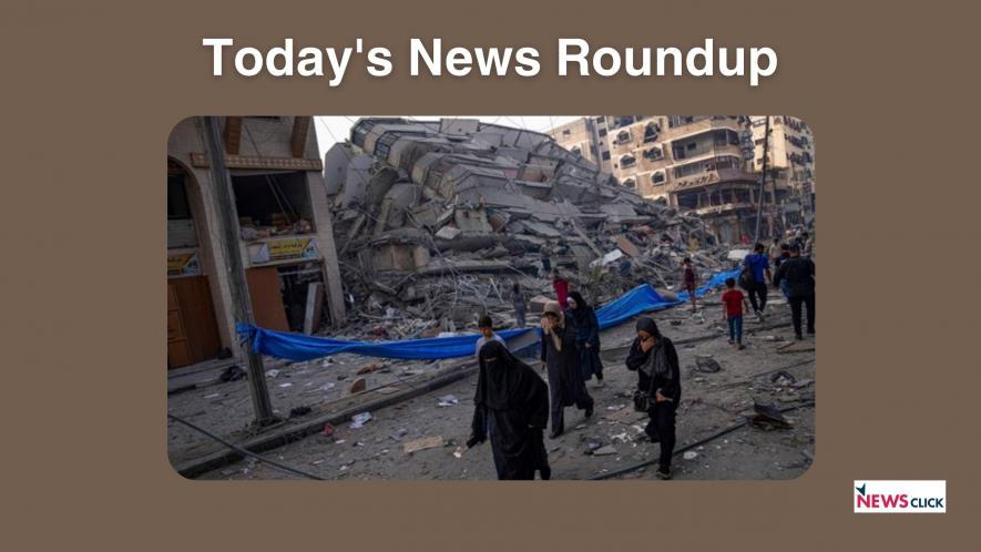 Palestinians walk by the rubble of a building after it was struck by an Israeli airstrike, in Gaza City, Sunday, Oct. 8, 2023. 