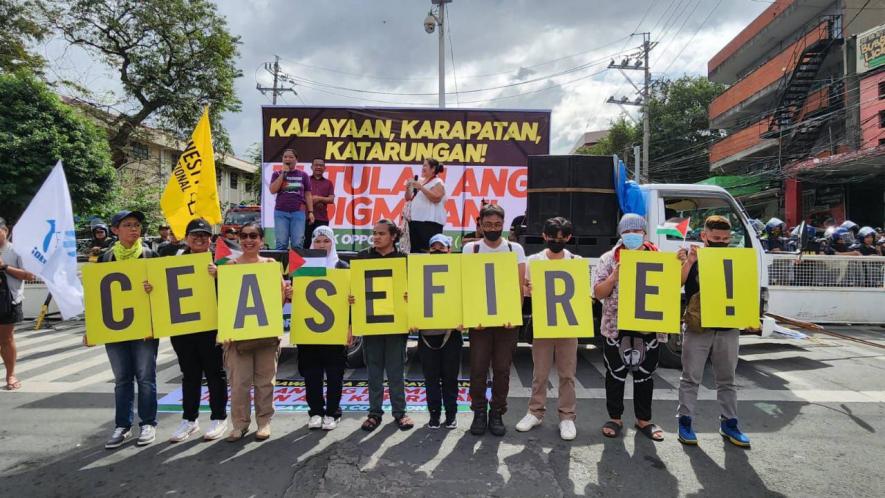 Workers in Manila, Philippines call for a ceasefire (Photo: Arnel PM)