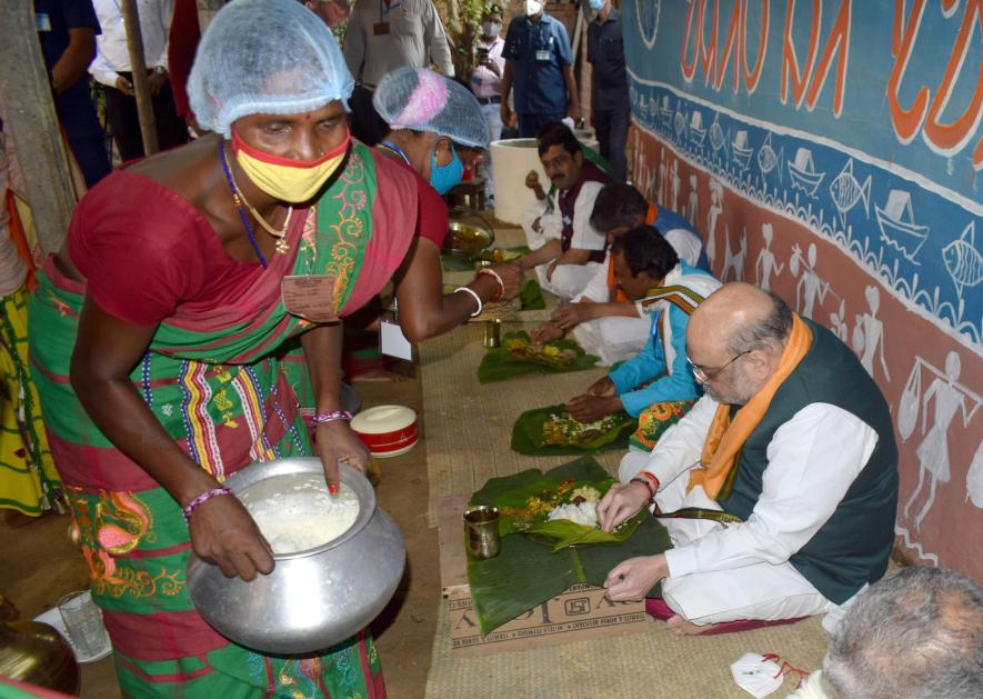 Union Home Minister Amit Shah having lunch along with BJP leaders on November 5, 2020, in Hansda’s house at Chaturdhihi village.