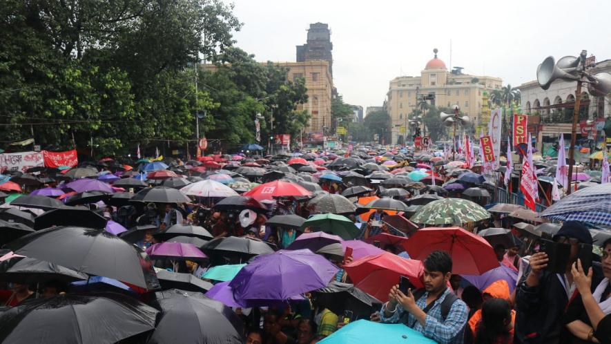 Rally amid the rains by Left-wing organisations SFI, DYFI, AIDWA at Dharmatala on September 26.