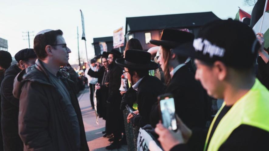 Zionist protesters confronting members of Neturei Karta participating in a pro-Palestine protest in Cedarhurst, Long Island.