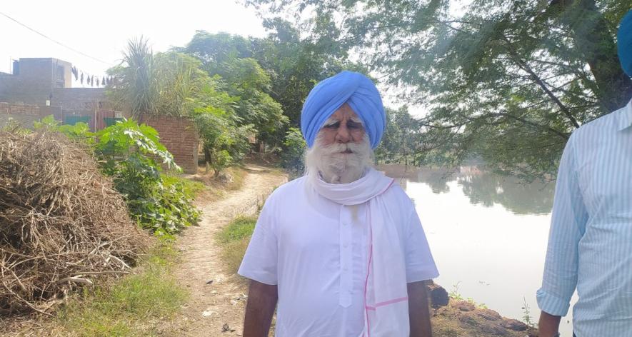 Villager showing the dilapidated pond in Burj village (Photo - Amarpal Singh Verma, 101Reporters).